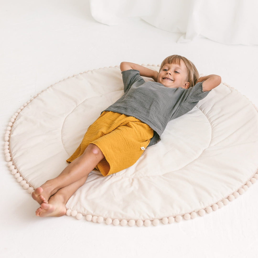 Speelmat voor kinderen met pompomranding